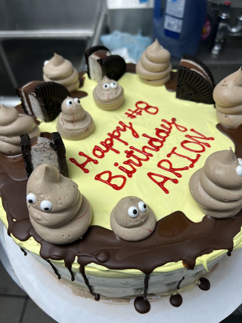 Playful poop emoji custom ice cream cake